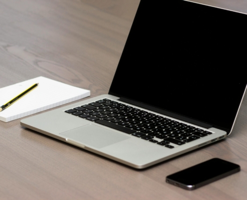 Free Silver Macbook Beside Iphone Stock Photo